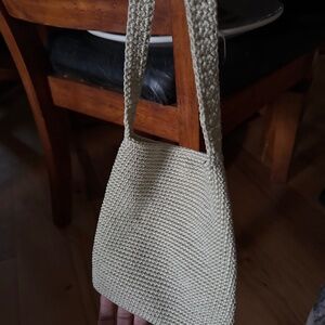 This  bag is a offwhite crochet boho slouch shoulder zip top bamboo ring strap